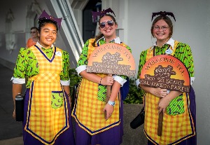 Three cast members in their colourful halloween party Costumes