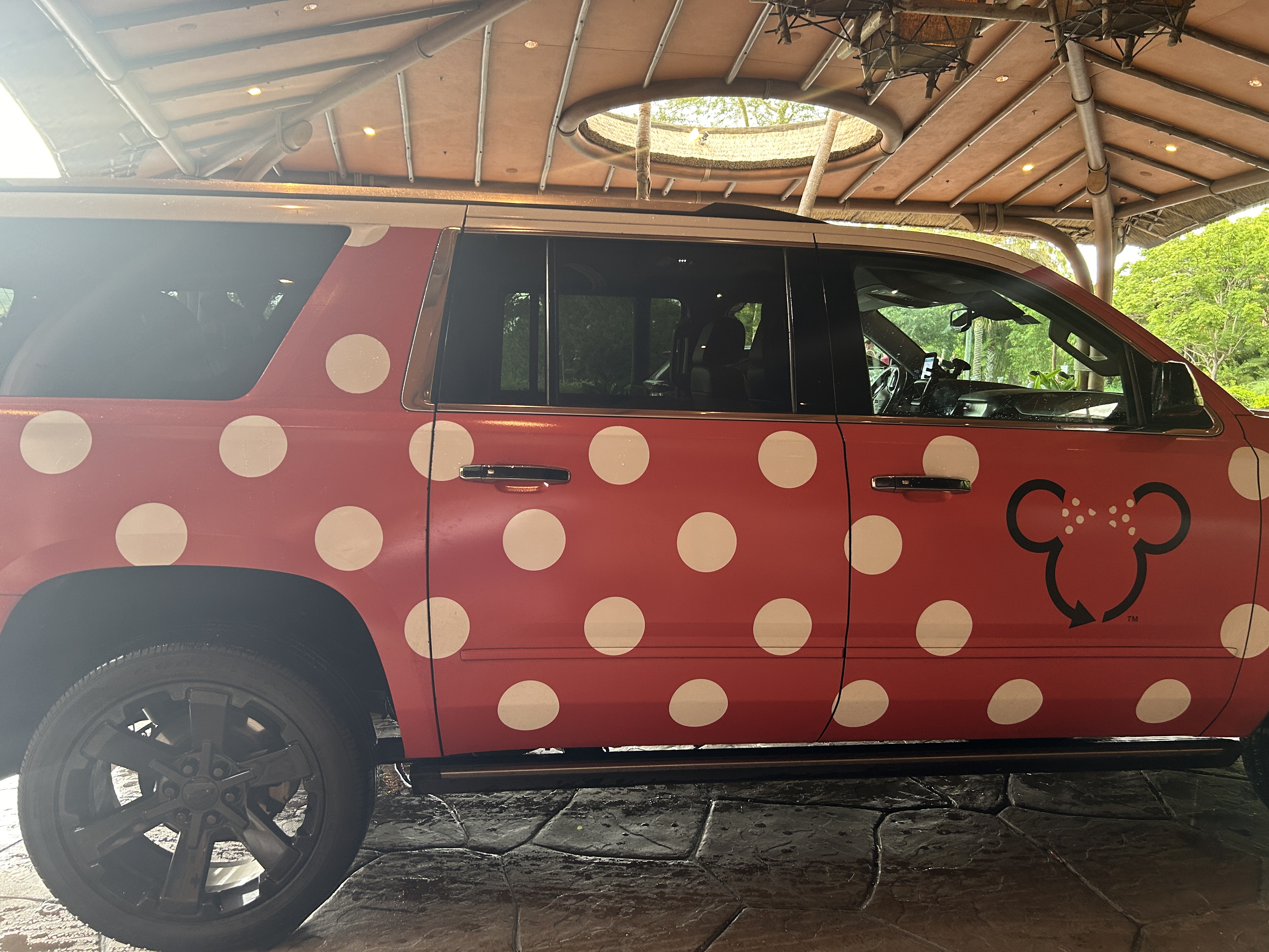 a red car with white spots on it