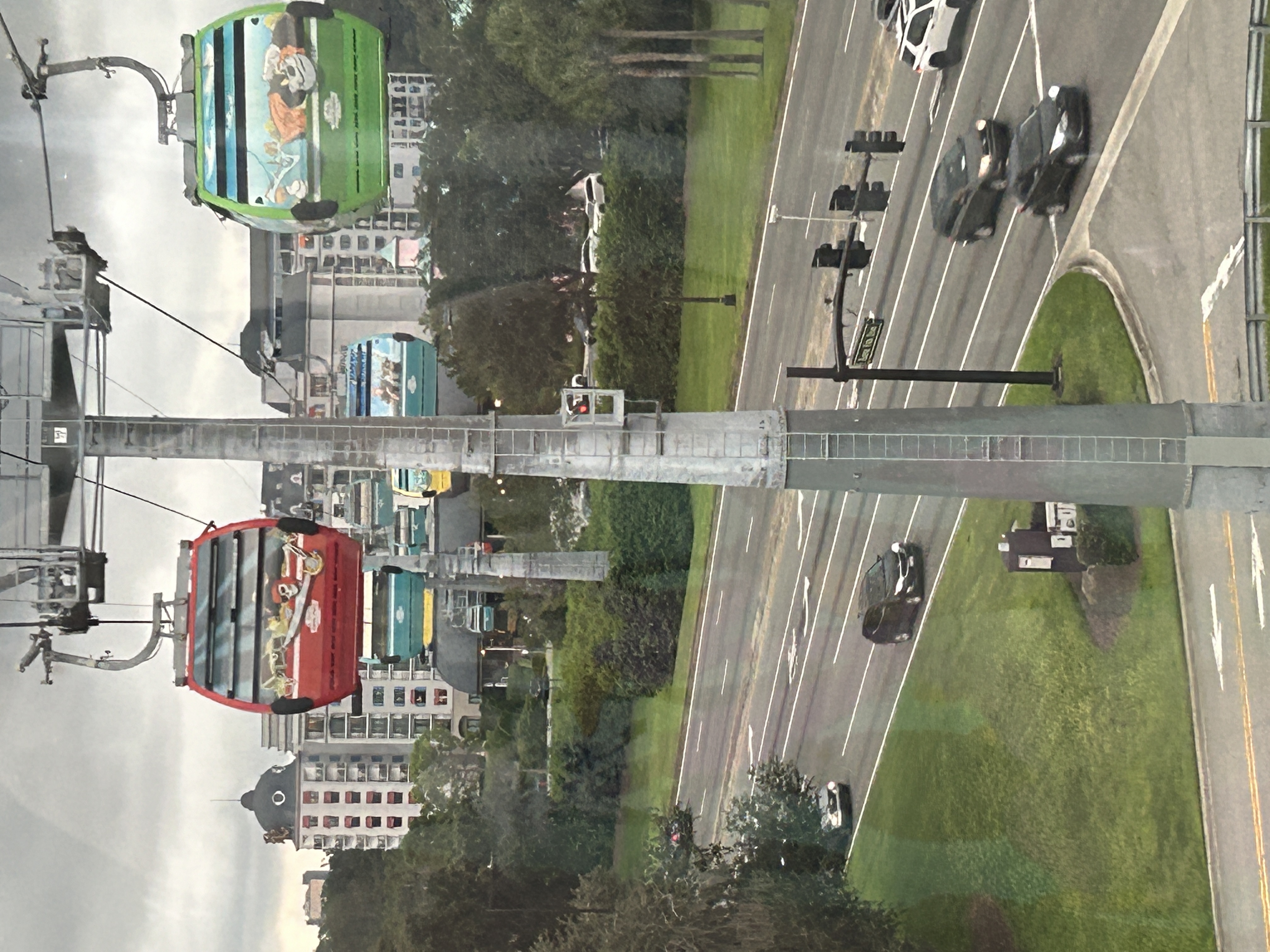skyliner two gondolas hanging on red one green