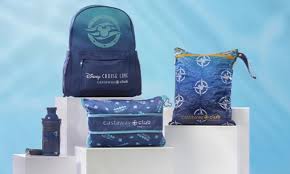 A blue back pack, blue wet and dry bag, metal water bottle and pillow saying castaway club