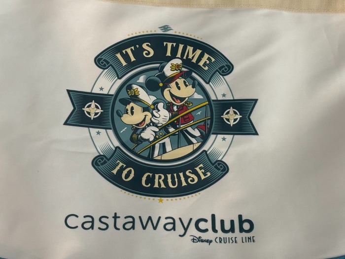 Mickey and Minnie mouse dressed as sea captains in a porthall with writing around the outside 