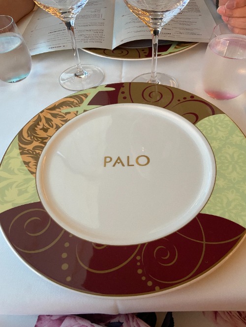 Image shows a round plate with decoratve border and the word Palo one the centre