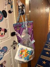 fish extenders Disney cruise, pixie dusting Disney cruise, what is a fish extender, Disney cruise fish extender, fish extender exchange, magnet exchange Disney cruise, pixie dust gifts cruise, Disney Cruise Line gift traditions, fish extender pouch, Disney cruise tips, Disney cruise for beginners, stateroom door hook, Disney Cruise Line, cruise gift exchange