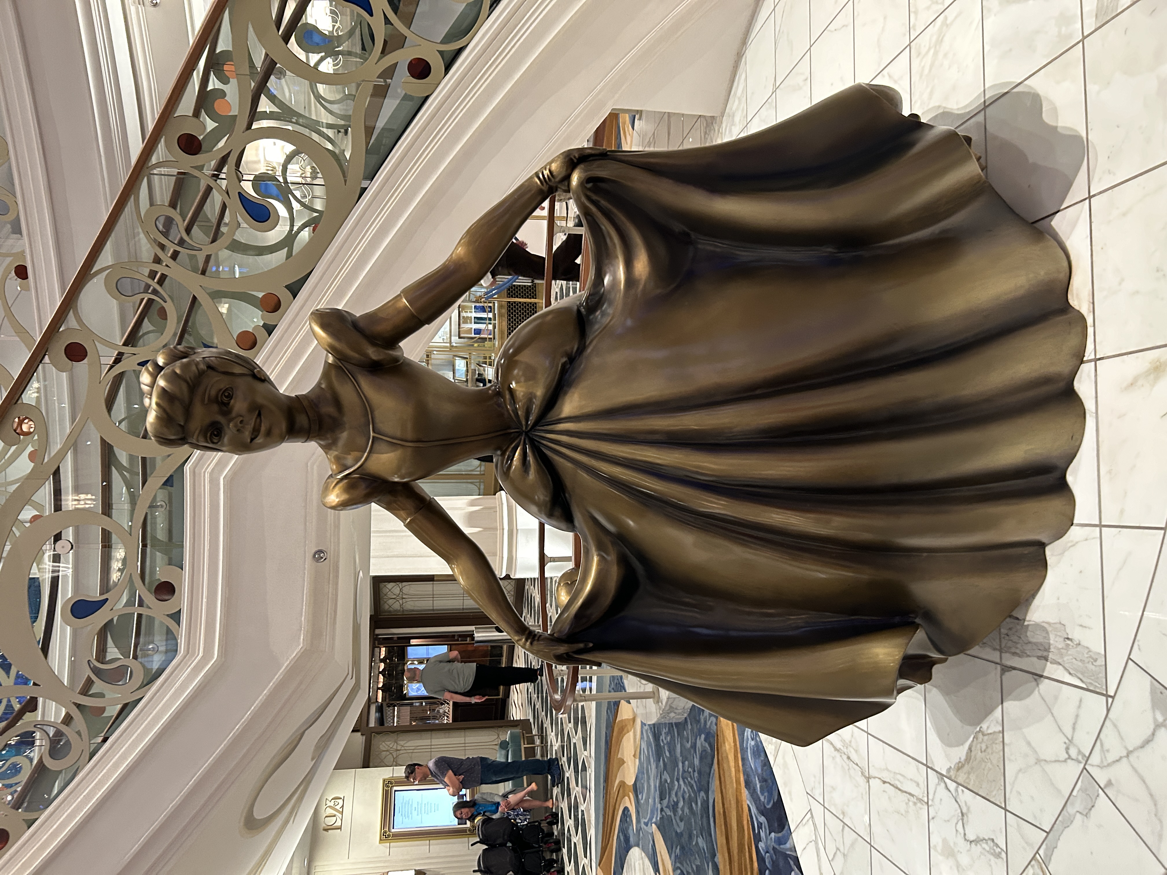 Image shows a bronze statute of Cinderella