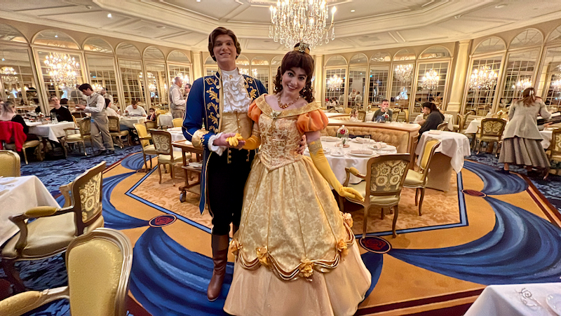 Image shows a prince and princess belle in an elegant looking restaurent