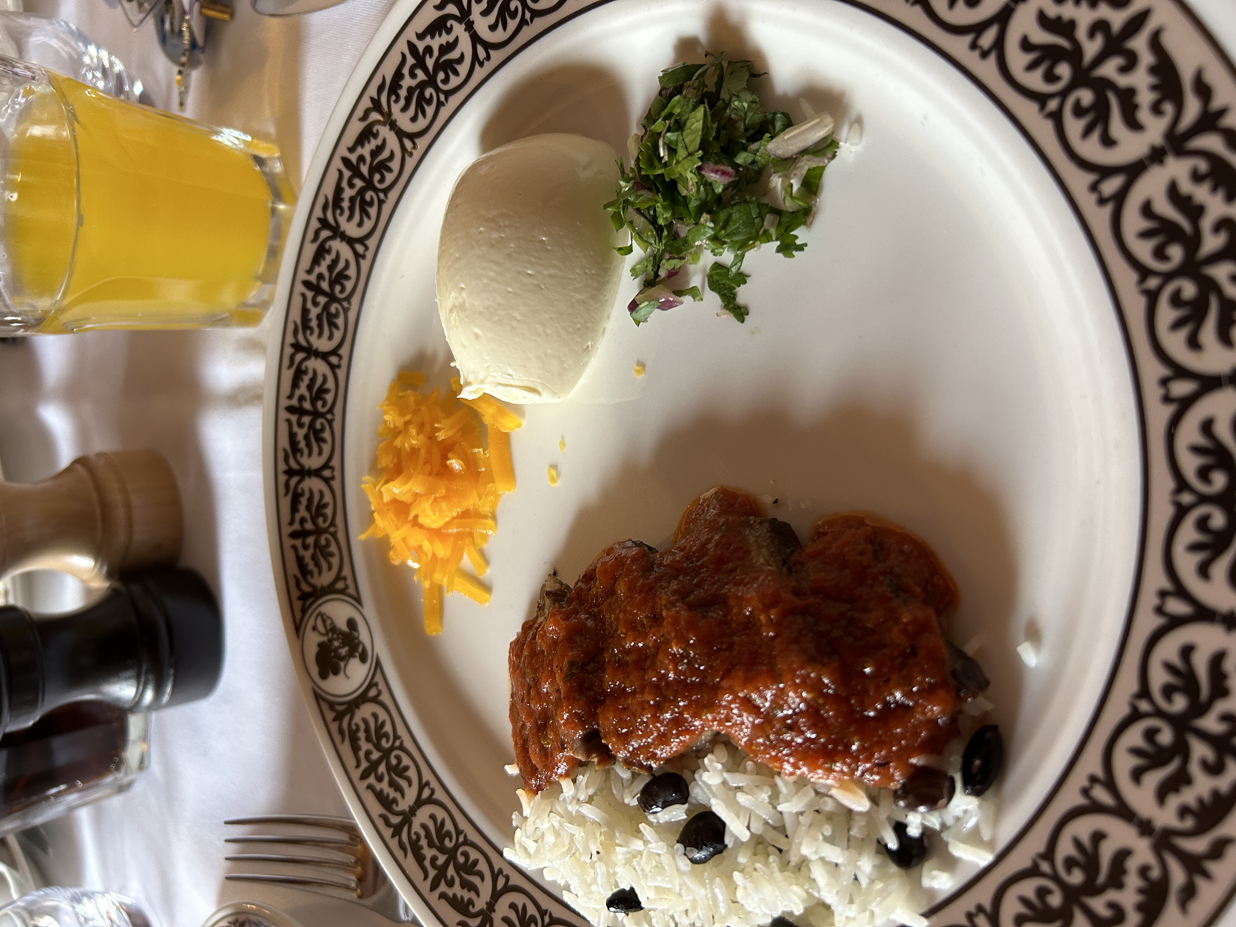 A plate with a serving of chilli and rice