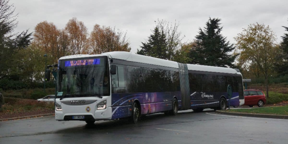 Shuttle bus with disneyland paris on and a flex bend in the middle